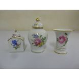 Meissen tea caddy, a Meissen vase and cover and a Meissen vase all decorated with floral sprays