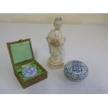A Chinese blanc de chine figurine and two blue and white circular boxes and covers one in original