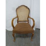 Art Deco mahogany armchair with bergere back, upholstered seat and cabriole legs