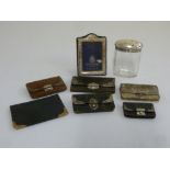 A quantity of leather purses with silver mounts, a silver photograph frame and a dressing table