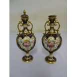 A pair of Doulton hand painted vases, one with cover