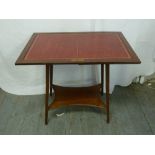 Edwardian mahogany rectangular games table with tooled leather top on four tapering legs