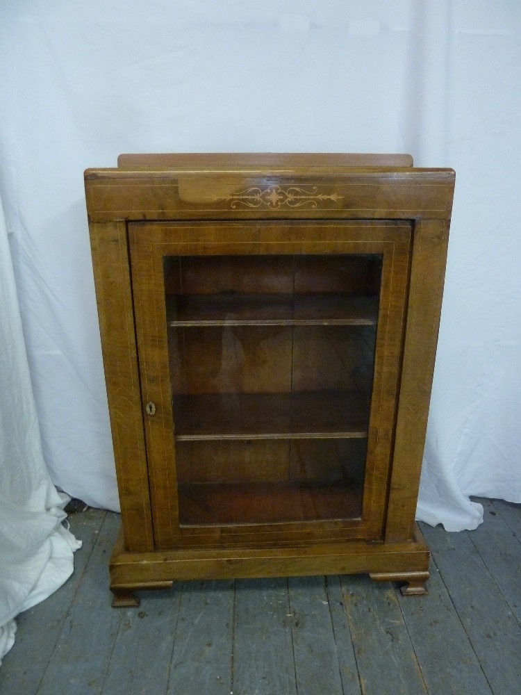 Edwardian mahogany rectangular bookcase with hinged glazed door on four bracket feet
