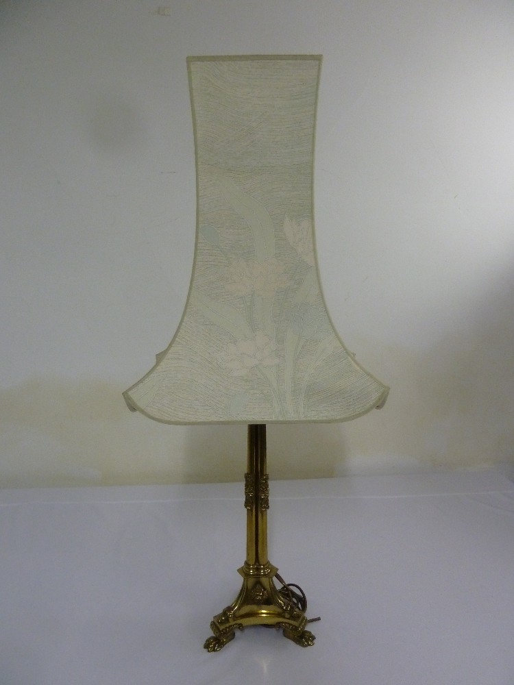 Gilded metal table lamp on three claw feet to include silk shade