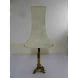 Gilded metal table lamp on three claw feet to include silk shade