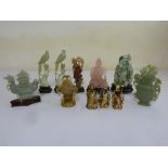 A quantity of Oriental carved figurines to include jadeite and rose quartz (11)