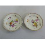 Meissen a pair of 19th century fruit plates decorated with hand painted flowers, marks to the base