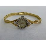 18ct gold Winegartens Ltd ladies wristwatch with diamond bezel, approx total weight 25.3g