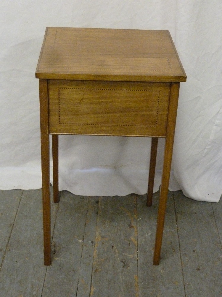 Edwardian square sewing table with hinged cover revealing sewing pieces, on four rectangular legs