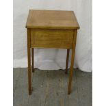 Edwardian square sewing table with hinged cover revealing sewing pieces, on four rectangular legs