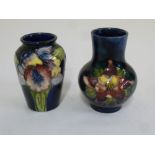 Moorcroft two miniature vases decorated with flowers and leaves, marks to the bases