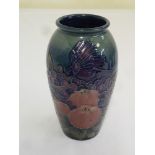 Moorcroft vase decorated with flowers, birds and fruit, signed to the base