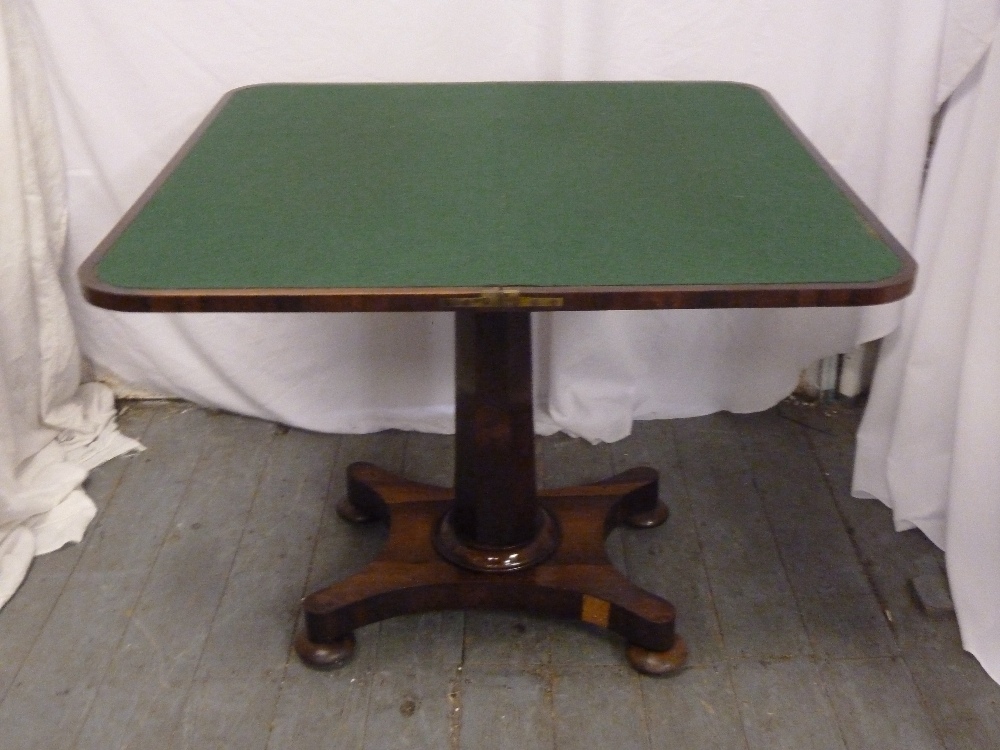 Victorian walnut veneered card table on pedestal stand with four pad feet