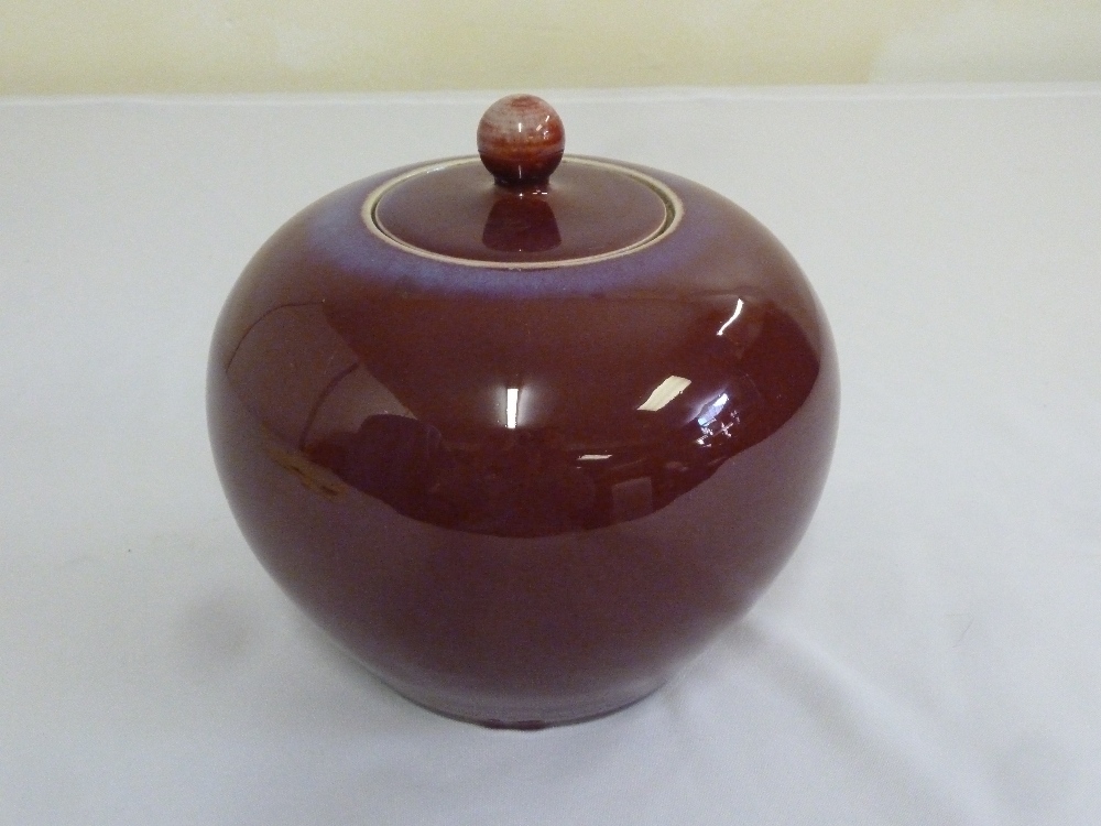 A 19th century Chinese flambe jar and cover