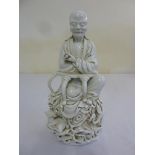 A 19th century Chinese blanc de chine figurine of Lohan