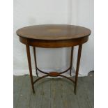 Edwardian oval occasional table on four tapering legs