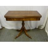 Reproduction mahogany card table on quatrefoil base