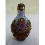 A Chinese Peking glass snuff bottle with applied decoration of birds and flowers