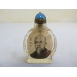 A Chinese early 20th century reverse painted snuff bottle with an image of an elder