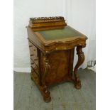 Victorian walnut davenport with four drawers on four bun feet