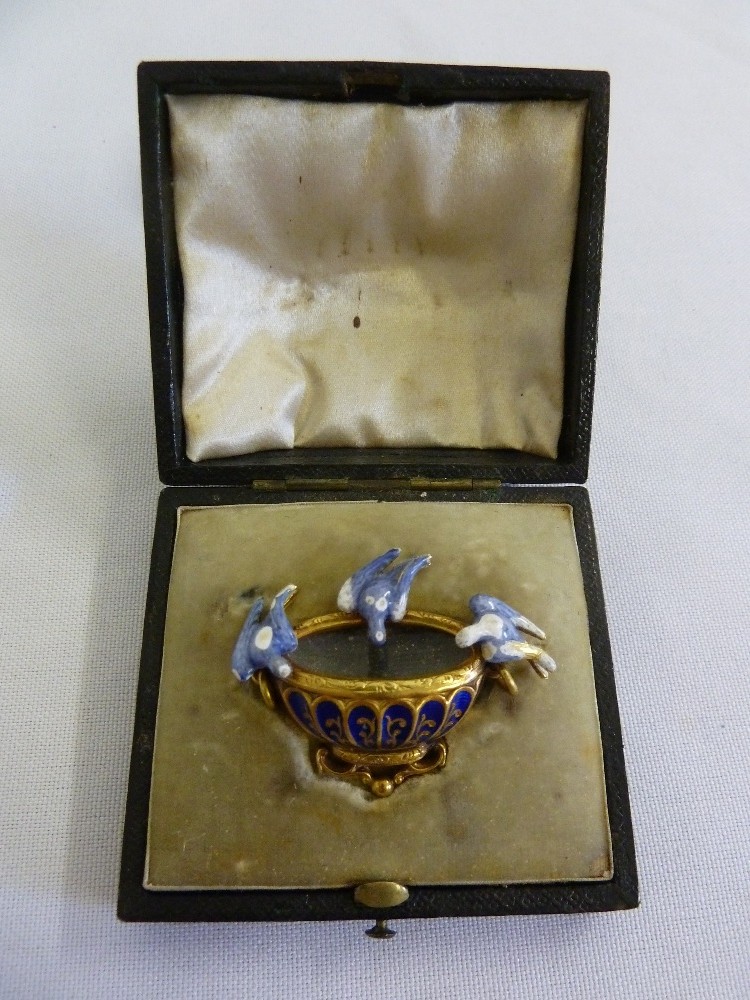 A late 19th century gilt and enamel mourning brooch in the form of The Doves of Pliny