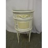 A French cylindrical painted bedside cabinet on four fluted legs