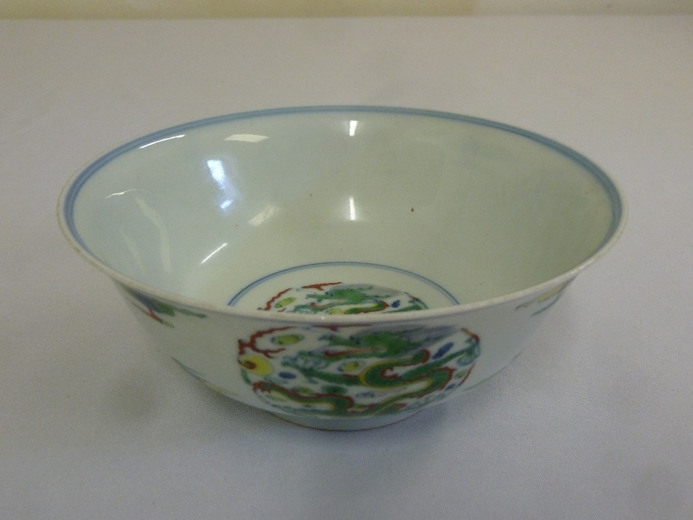 A 19th century Chinese Doucai bowl decorated with dragons