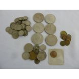 A quantity of coins to include crowns and silver threepences