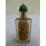 A Chinese early 20th century reverse painted snuff bottle with image of a hare and flowers