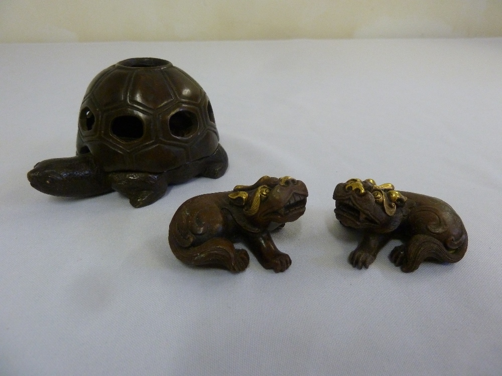 A Chinese bronze incense burner and a pair of lions