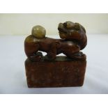 A 20th century Chinese soapstone seal carved with a lion