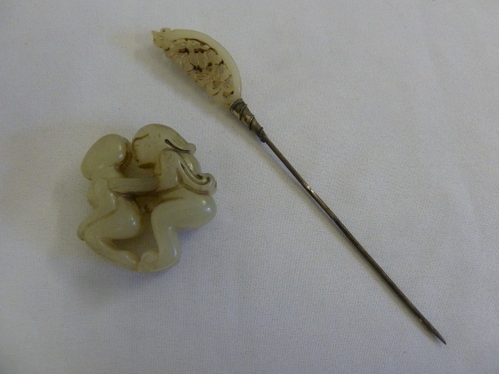 A 19th century Chinese hairpin and erotic jade pendant