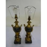 A pair of marble and gilt metal mounted vase form table lamps