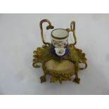 An Ormolu inkwell with mother of pearl and gilt metal stand