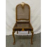 A early 20th century bergere occasional chair on cabriole legs