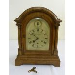 Mappin and Webb chiming oak cased bracket clock with arched top silvered dial, Roman numerals on