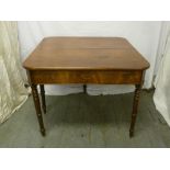 Victorian mahogany games table of rounded rectangular form on four turned cylindrical legs