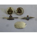 A quantity of military badges to include RAF silver and enamel wings, WAAG dog tag and three other