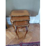 A nest of three Kingswood inlaid tables with gilt metal decorations on cabriole legs