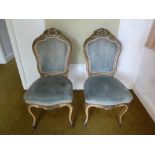 Pair of French boudoir chairs with upholstered seats and backs on cabriole legs