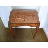 A French writing desk inlaid hinged cover with applied cast bronze mounts on cabriole legs A/F