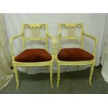 A pair of white painted French style occasional chairs on four simulated bamboo legs