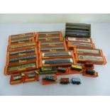 A quantity of Hornby 00 gauge coaches and rolling stock in original packaging (30)