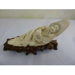 Japanese late 19th century ivory carving of a fisherman and fish, signed to verso, on hardwood