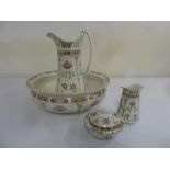 An Art Nouveau style porcelain wash set to include a bowl, water jug and soap dish