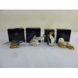 Royal Crown Derby porcelain figurines of animals to include a Penguin, a dolphin and seals, all with