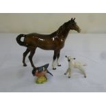 Three Beswick figurines of animals, a horse, a lamb and a bird