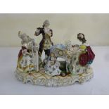 A Continental porcelain figural group, the figures in 18th century costume playing a variety of