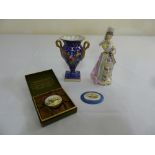 A Continental figurine, a French porcelain vase, an enamel box and a Sevres style plaque