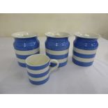 T.G. Green kitchenalia three blue and white biscuit barrels and a mug